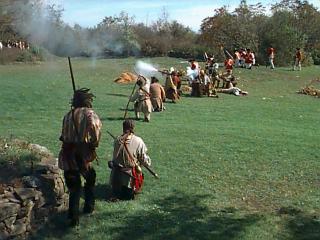 Loyalists, British and Indians, shooting at the militia